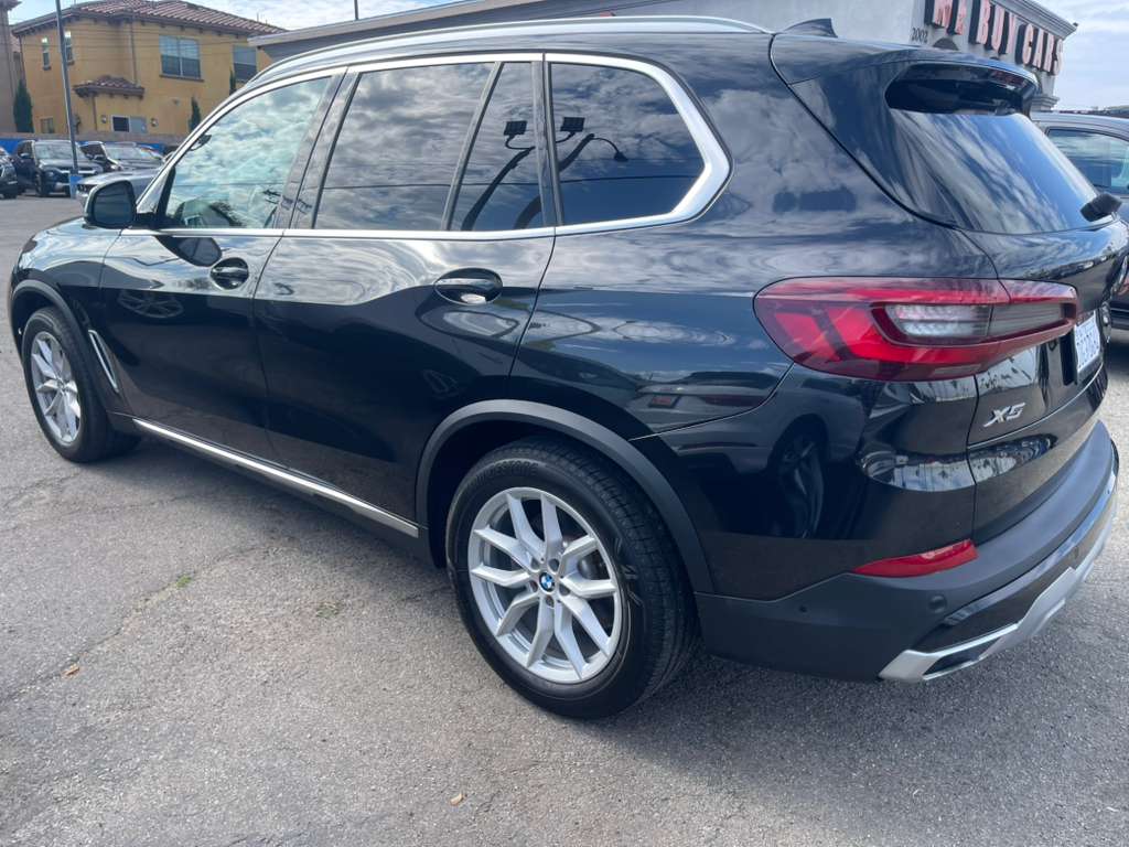 Black BMW X5 SUV parked on a street