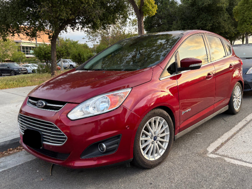 Front view of red 2013 Ford C-Max Hybrid parked in San Diego