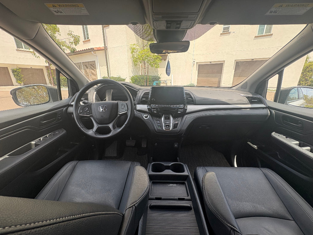 Interior of a Honda vehicle with dashboard and steering wheel visible