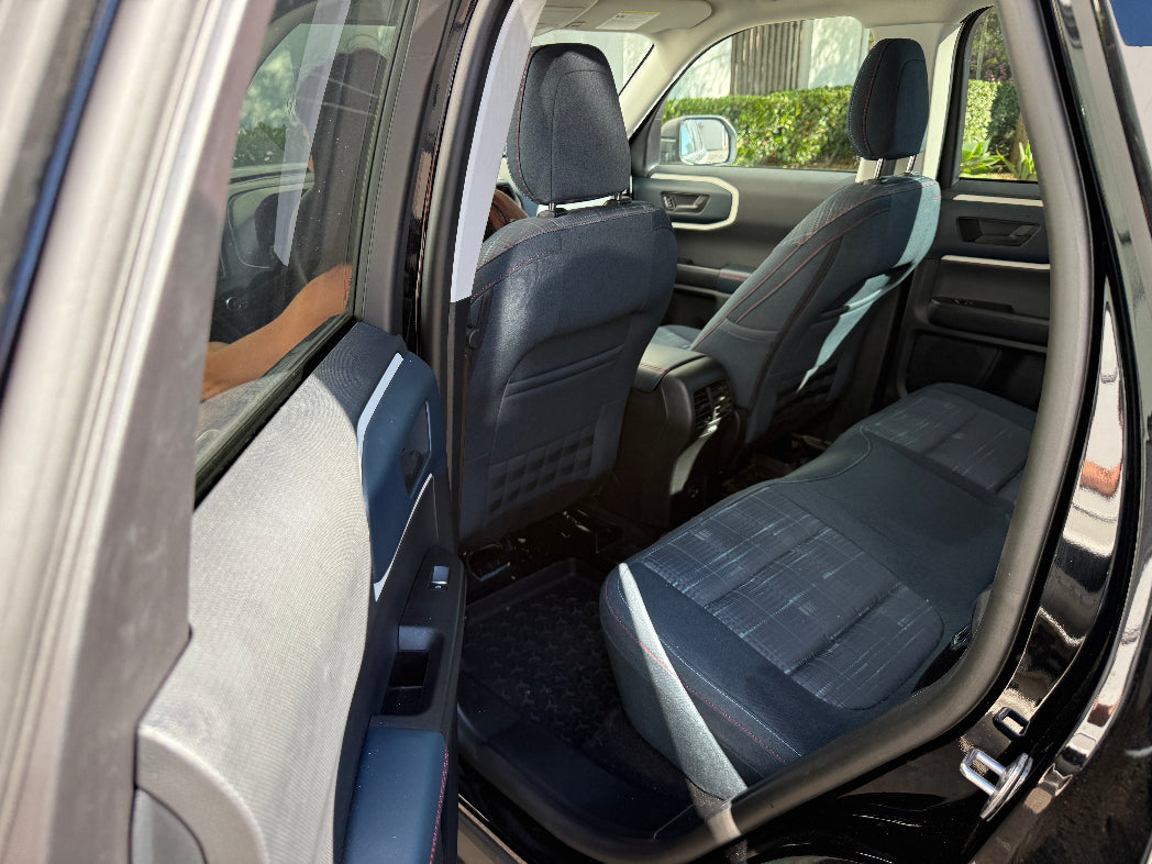 Car interior with open door showing blue seats