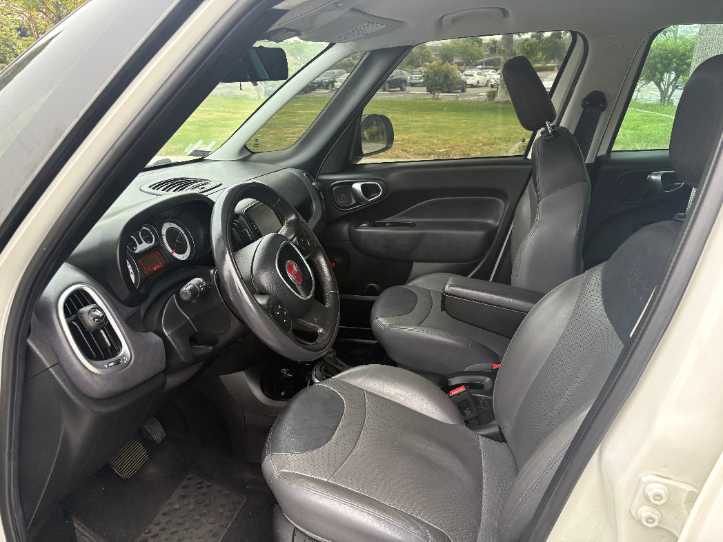 Car interior with steering wheel and dashboard view