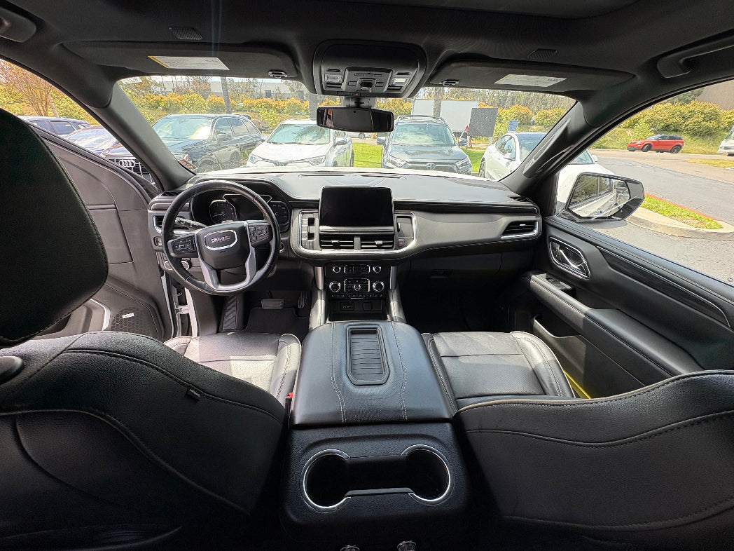 Interior dashboard and front seats of GMC Yukon 2024