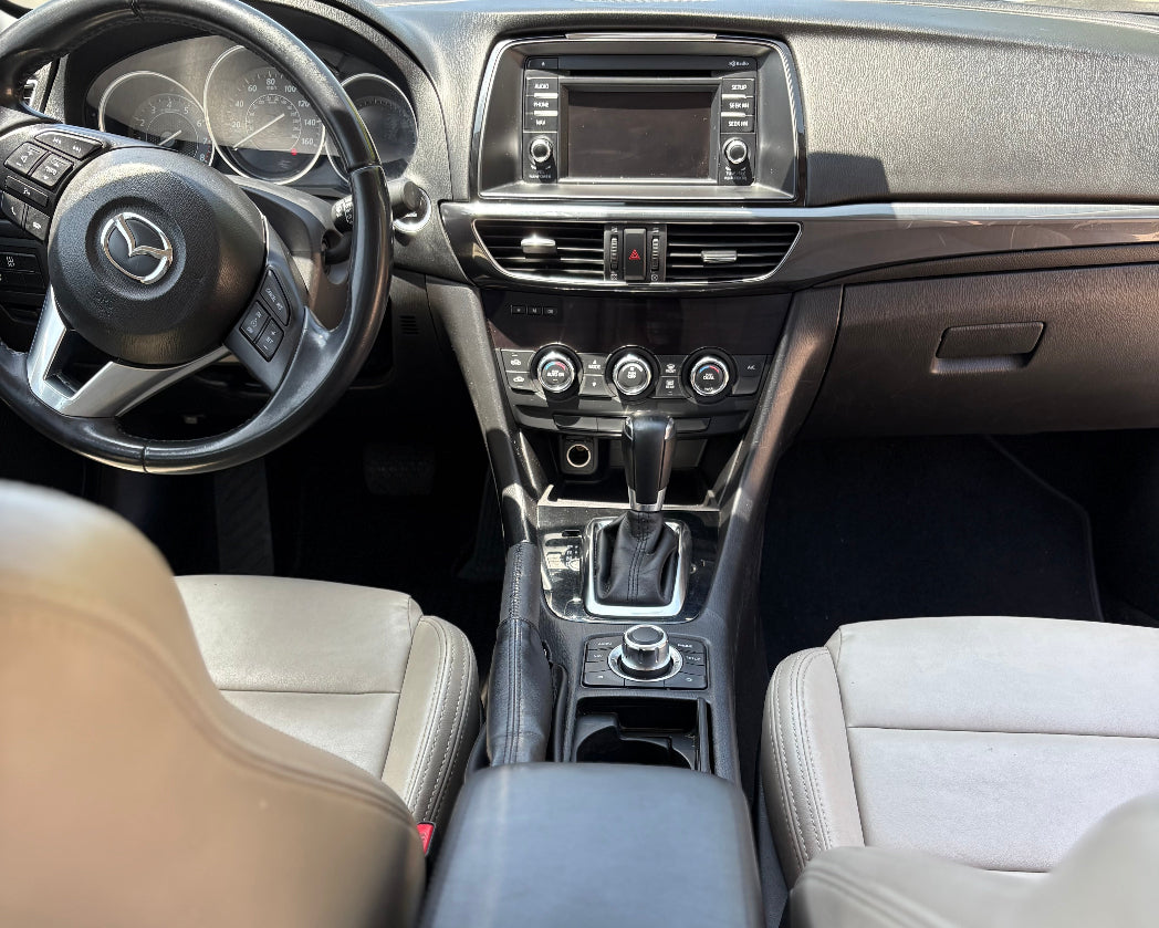 Car interior with steering wheel and dashboard view