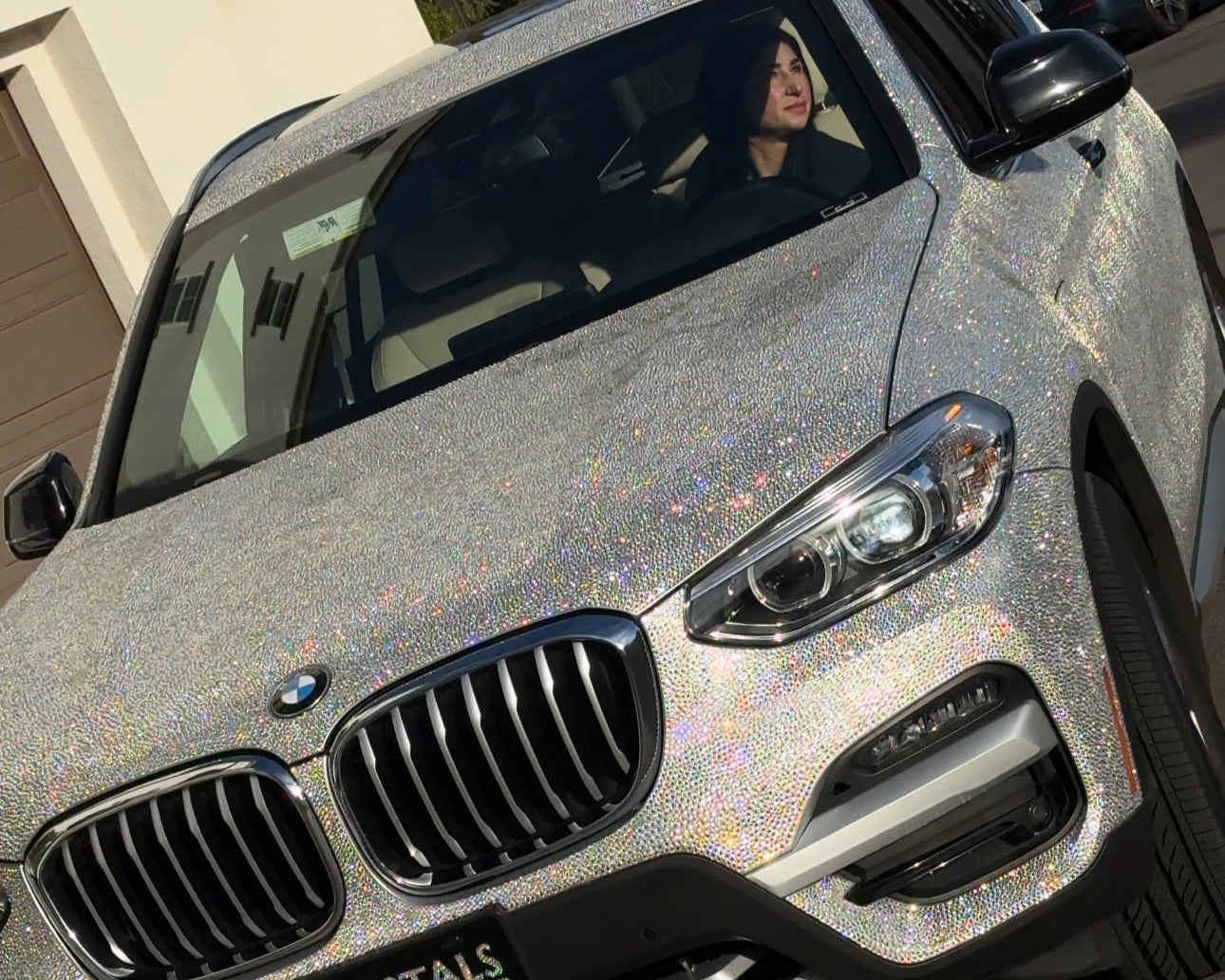 Crystal BMW X3 parked in San Diego – luxury car rental with a stunning shine effect