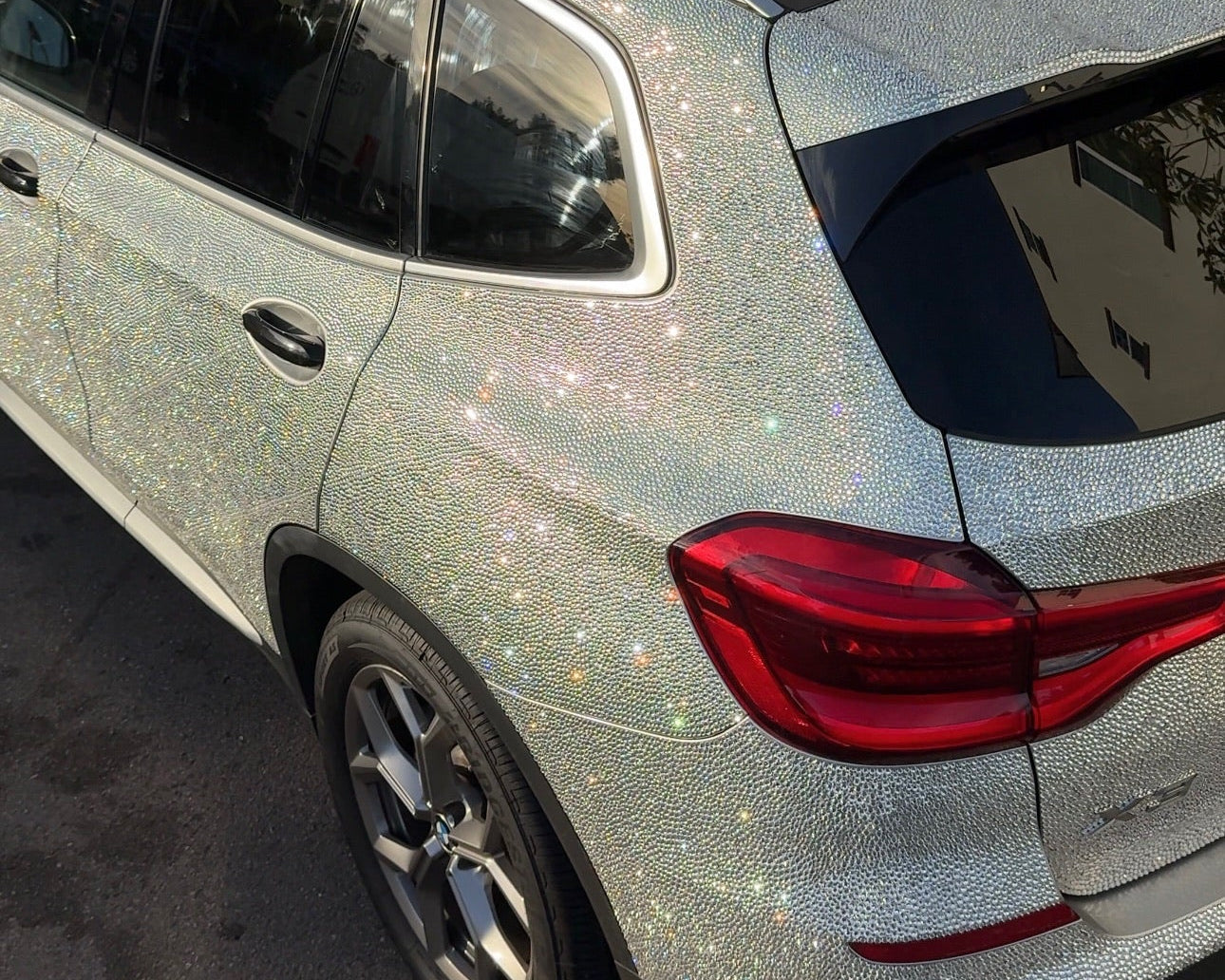 Crystal BMW X3 parked in San Diego – luxury car rental with a stunning shine effect