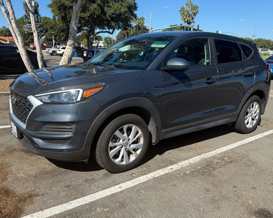 Front view of 2019 Hyundai Tucson SUV in grey exterior – available for rent in San Diego