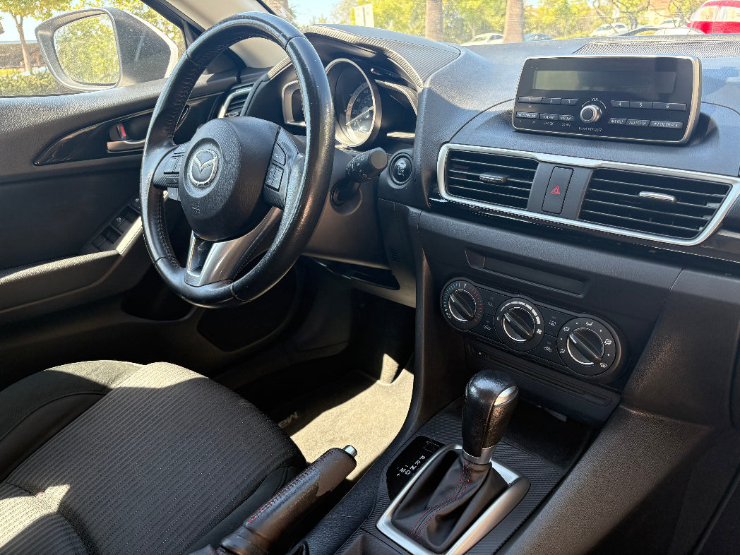 Rental Car interior with steering wheel and dashboard view