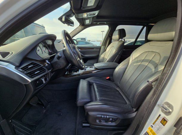 Car interior with steering wheel and dashboard view