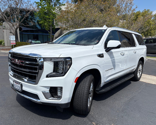 Front view of white 2024 GMC Yukon SUV parked in San Diego