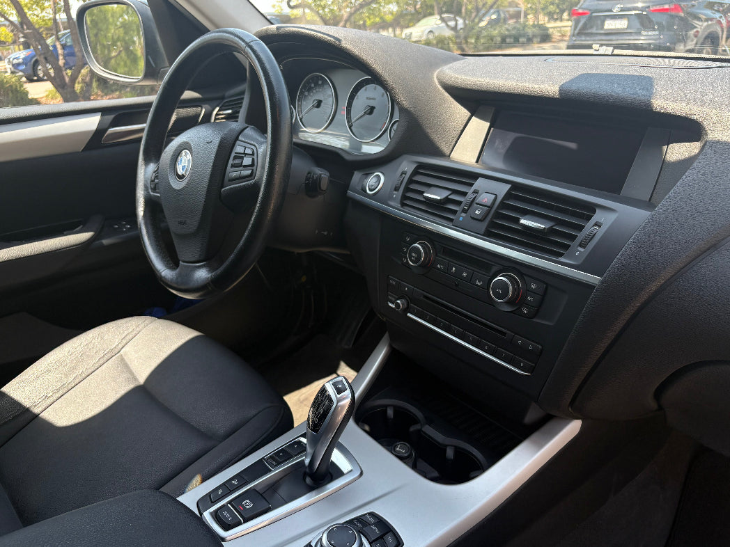 SUV Rental Car interior with steering wheel and dashboard view