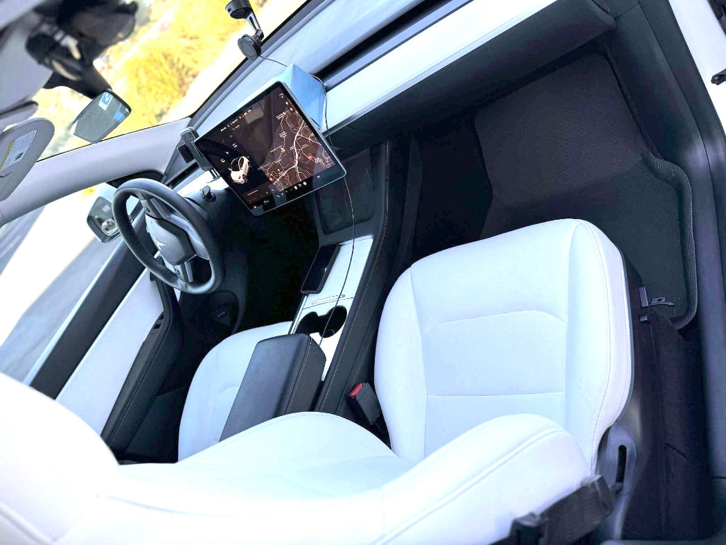 Car interior with white seats and a dashboard view