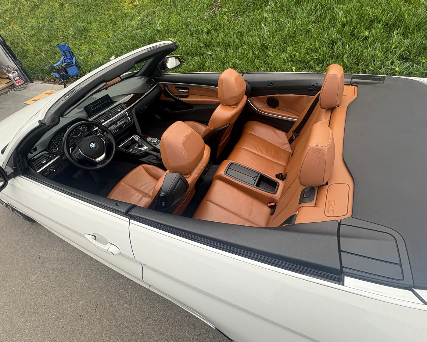 Open-top car with brown interior on a grassy area