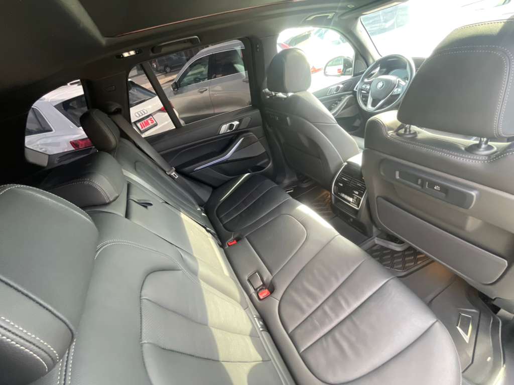 Interior of a car with gray leather seats and dashboard.