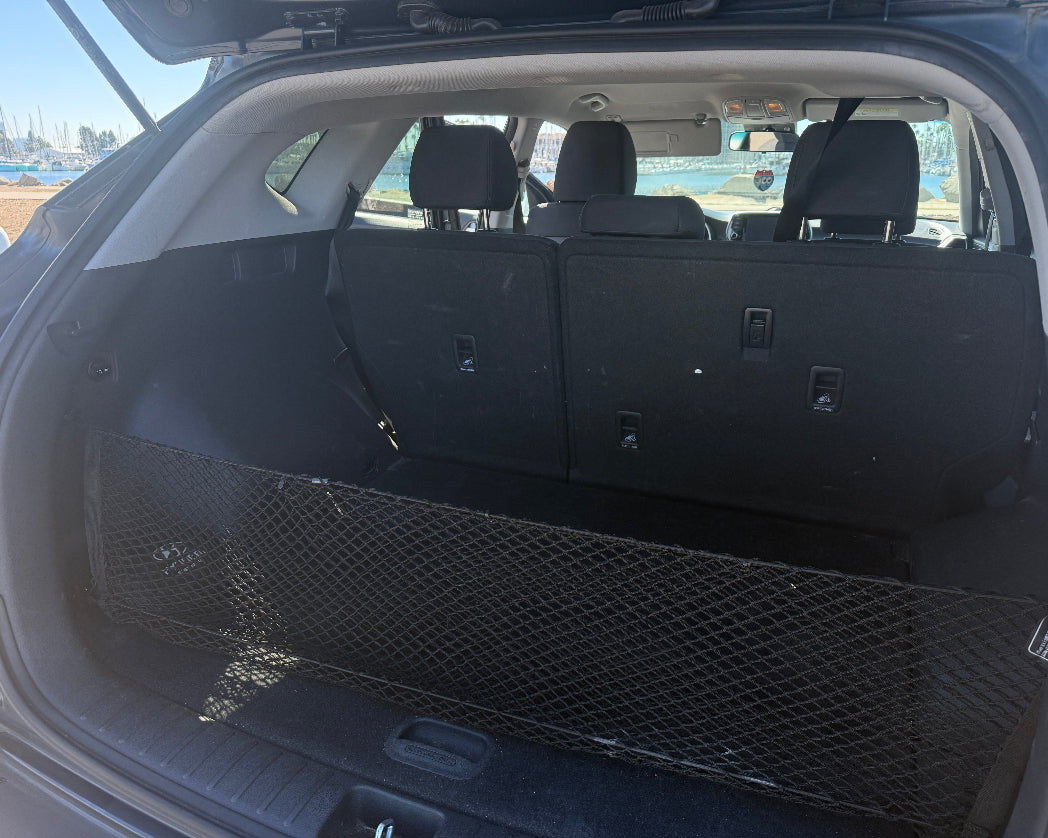 Large trunk with black cargo net for luggage 