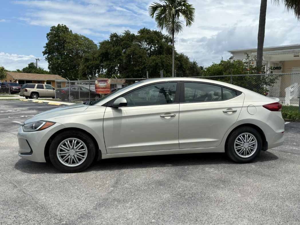 Side view of beige 2018 Elantra rental car in San Diego