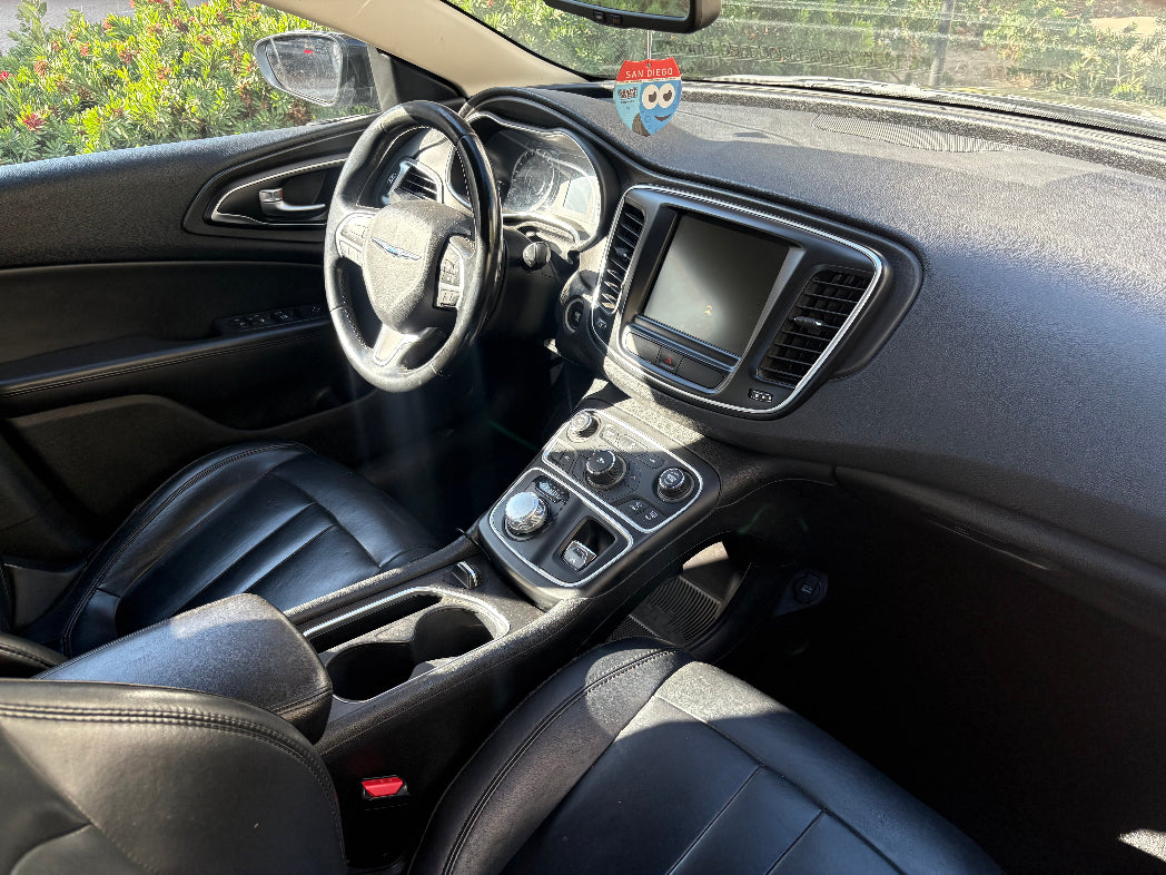 Car interior with dashboard and steering wheel visible