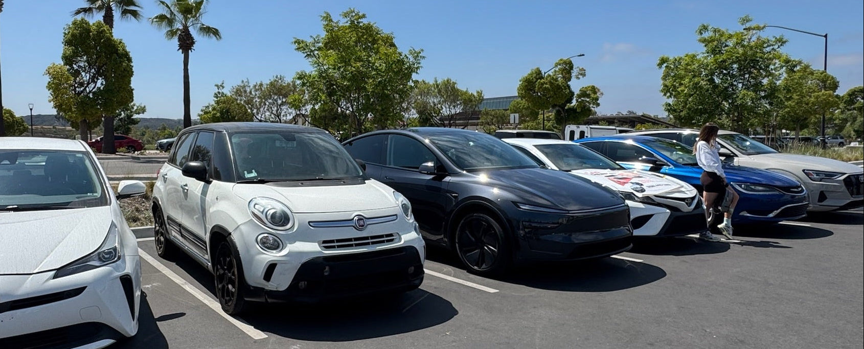 Row of car rentals parked in San Diego lot for tourist vocation rental